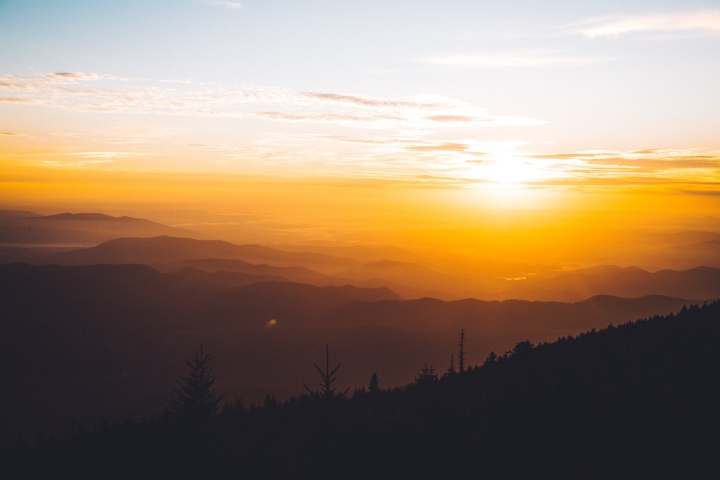 The wonderful news of the coming Kingdom of God is the heart and core of Jesus Christ’s message for humanity. Jesus will return to earth and establish this Kingdom. Sun rays shining over hills.