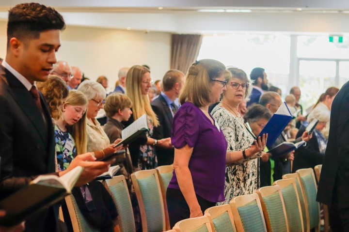 Brethren observing the Holy Days in Merimbula, Australia a group of people singing hymns in church