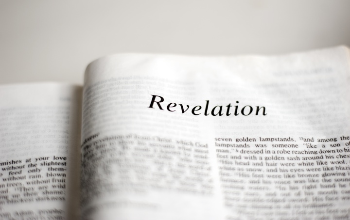 The book of Revelation is in a class of its own. A Bible opened to first page of Revelation.
