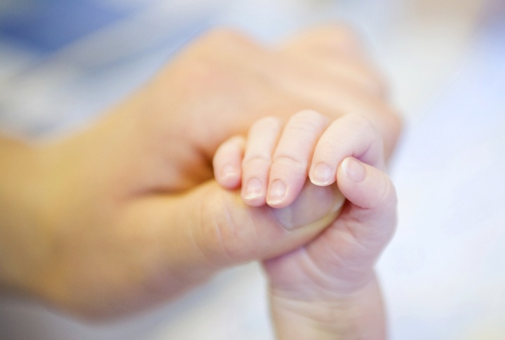 That family relationship—our becoming children of God the Father —is the heart and core of God’s incredible plan for humanity! A person holding a baby's hand.
